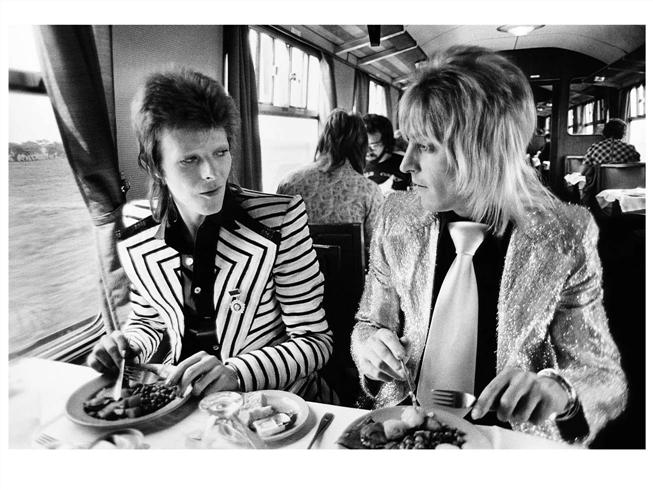 David Bowie and Mick Ronson, Train to Aberdeen, 1973, photographed by Mick Rock.