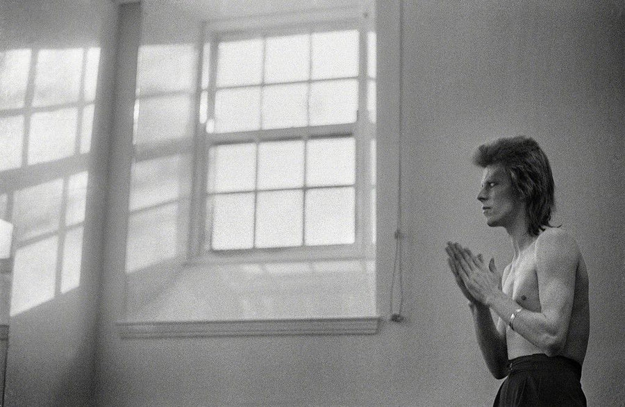 David Bowie at the Window, Scotland, 1973, photographed by Mick Rock.