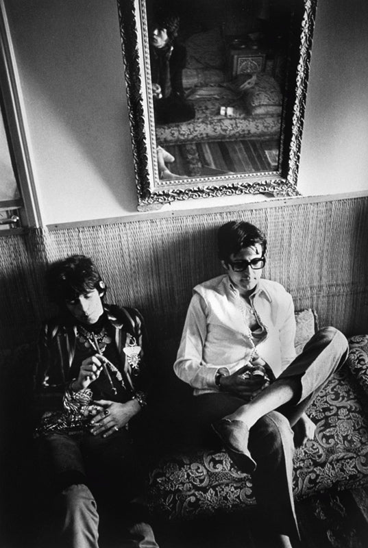 Keith Richards and Robert Fraser on a banquette in Morocco, photographed by Michael Cooper, 1967.