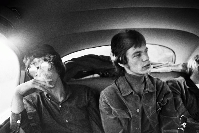 Keith Richards and Mick Jagger in the back of a limousine, London, photographed by Michael Cooper, 1967.