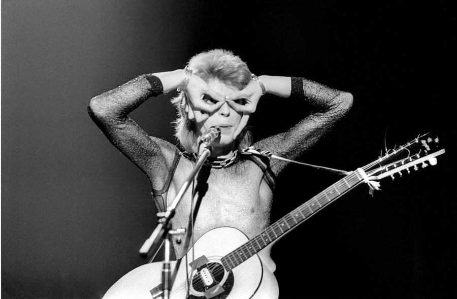 David Bowie Performing with Guitar, United Kingdom, 1973, photographed by Mick Rock.