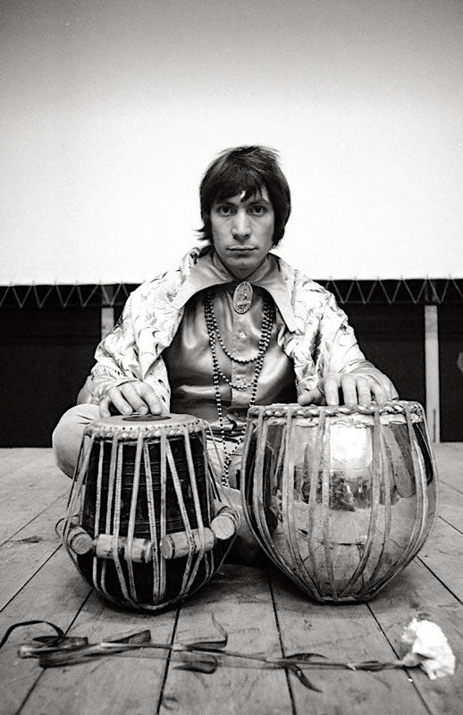 Charlie Watts of the Rolling Stones with tabla drums, New York, photographed by Michael Cooper, 1967.