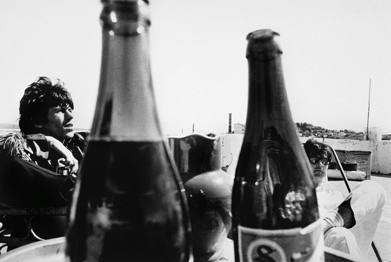 Keith Richards and Robert Fraser at a cafe in Morocco, photographed by Michael Cooper, 1967.
