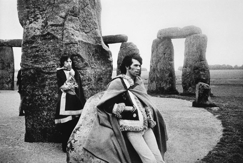 Mick Jagger and Keith Richards at Stonehenge, photographed by Michael Cooper, 1968.