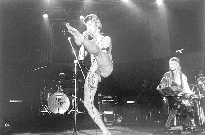 David Bowie performing on stage on the 1973 UK tour, photographed by Mick Rock. Unique vintage gelatin silver print.
