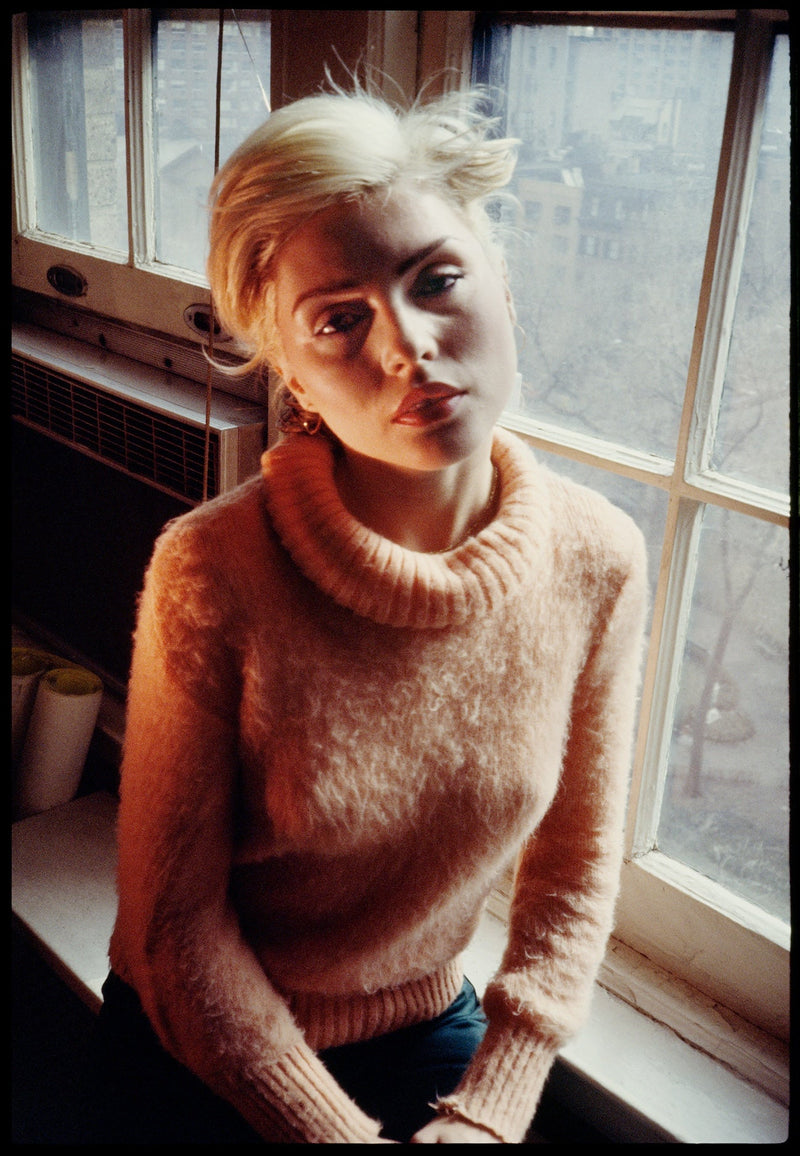 Debbie Harry in Pink Sweater, New York City, date unknown, photographed by Chris Stein.