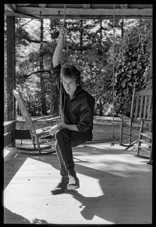 Bob Dylan, sitting on a Swing, Woodstock, New York 1964