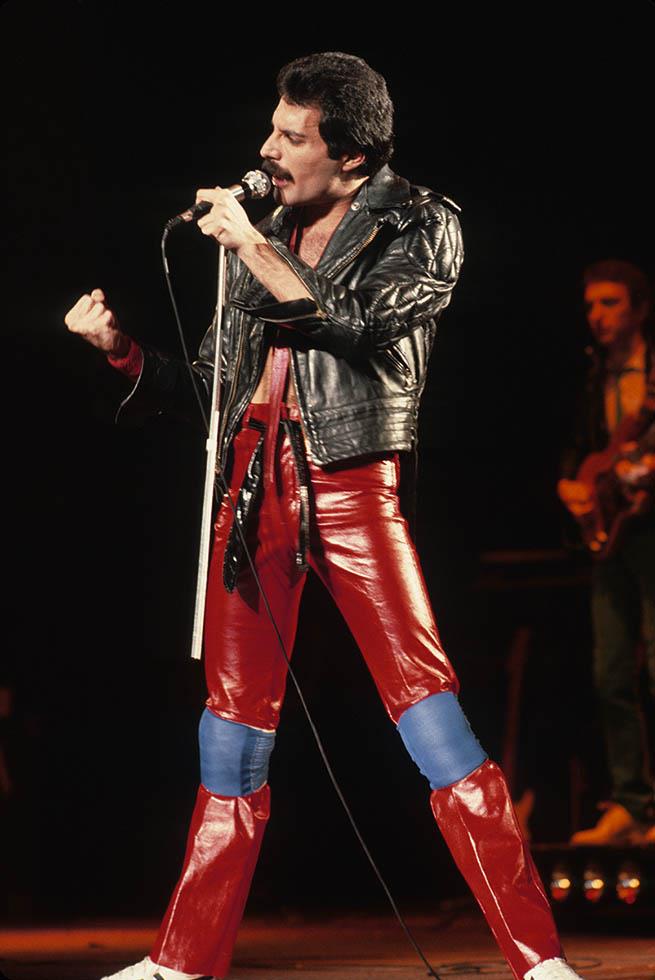 Freddie Mercury of Queen in red leather trousers on stage in New York City, photographed by Charlyn Zlotnik, 1980.