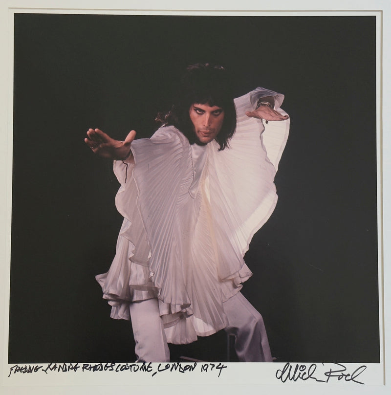 Freddie Mercury in Zandra Rhodes costume, London, 1974, hand-titled and signed by Mick Rock.