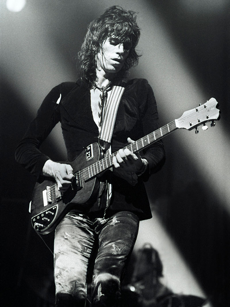 Keith Richards performing with an electric guitar in 1973. Photograph by Gijsbert Hanekroot.