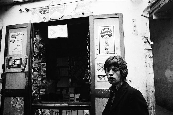 Mick Jagger outside a shop in Tangiers, Morocco, photographed by Michael Cooper, 1967.
