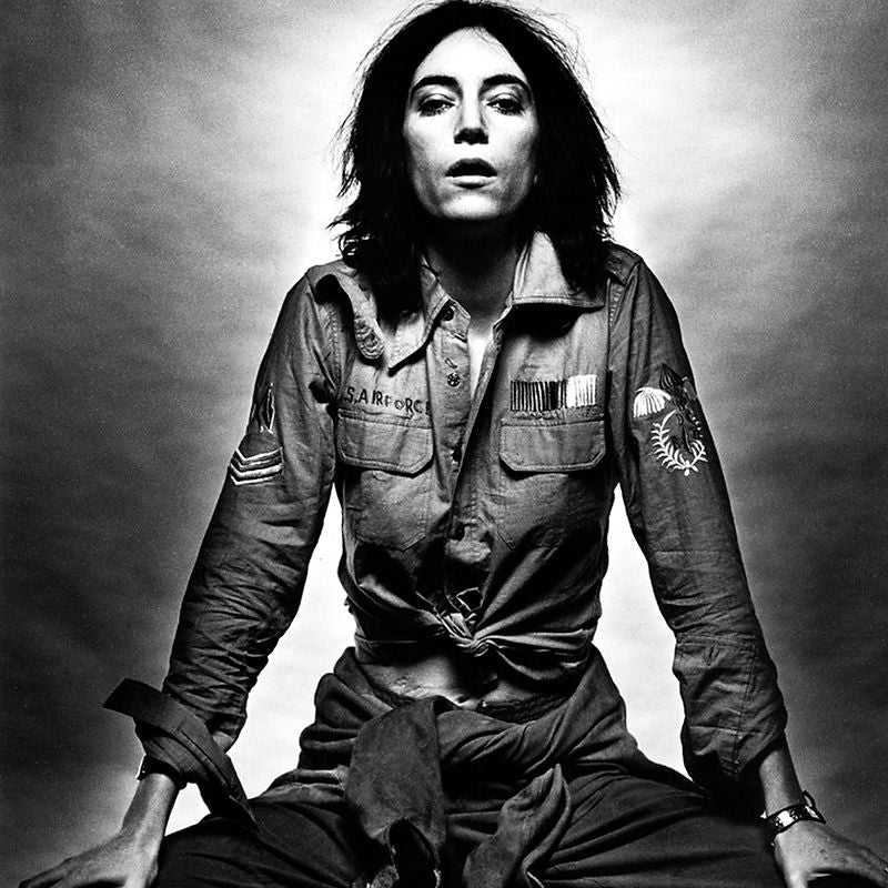 Patti Smith leaning forward with both hands braced beside her in 1976. Photograph by Gijsbert Hanekroot.