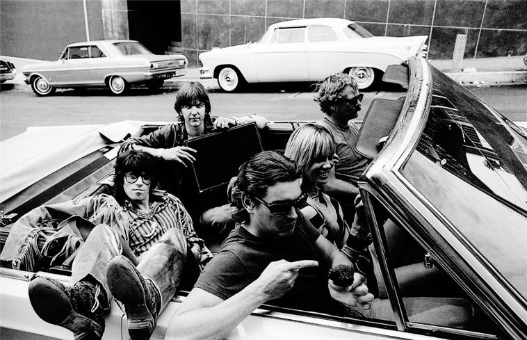 Keith Richards, Gram Parsons, Anita Pallenberg, Tony Foutz and Phil Kaufman in a car, Los Angeles, photographed by Michael Cooper, 1968.