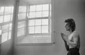 David Bowie at the Window, Scotland, 1973, photographed by Mick Rock.