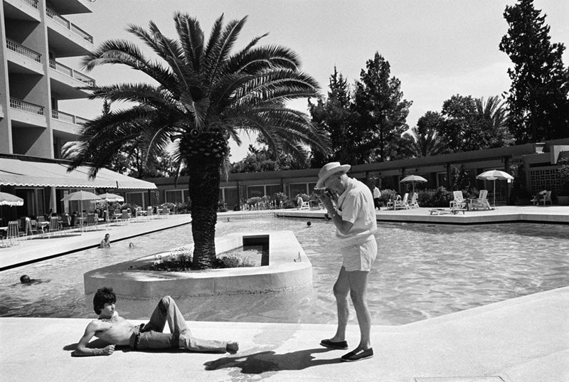 Keith Richards posing poolside for Cecil Beaton at the Hotel Mamounia, Tangier, Morocco, photographed by Michael Cooper, 1967.