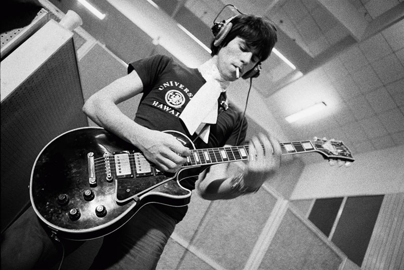 Keith Richards playing guitar at Olympic Studios, London, photographed by Michael Cooper, 1966.