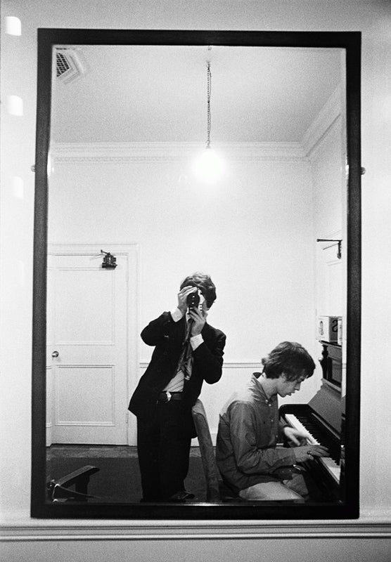 Michael Cooper and Mick Jagger at the piano seen in reflection, Olympic Studios, London, 1966.
