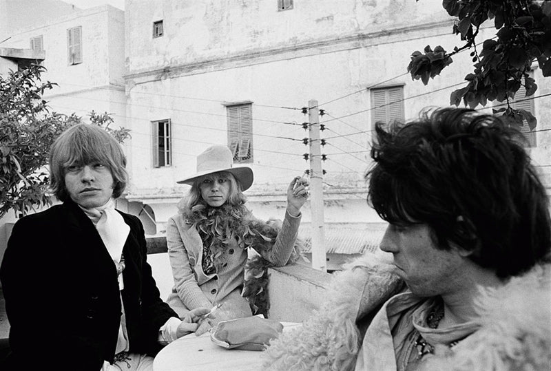 Brian Jones, Anita Pallenberg and Keith Richards at a cafe in Marrakesh, Morocco, photographed by Michael Cooper, 1967.