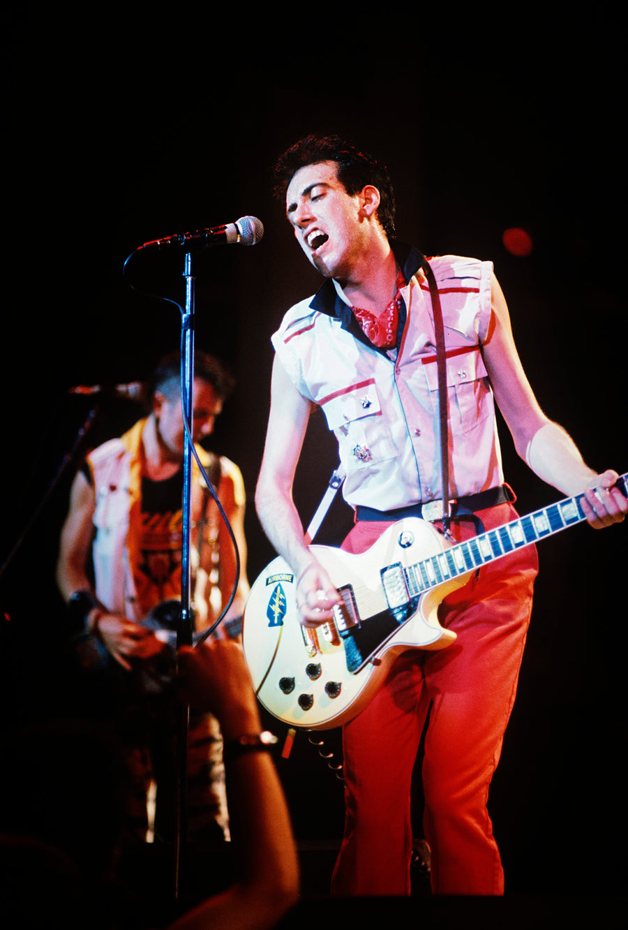 Mick Jones performing with guitar, New York City, 1981, photographed by Michael Grecco.