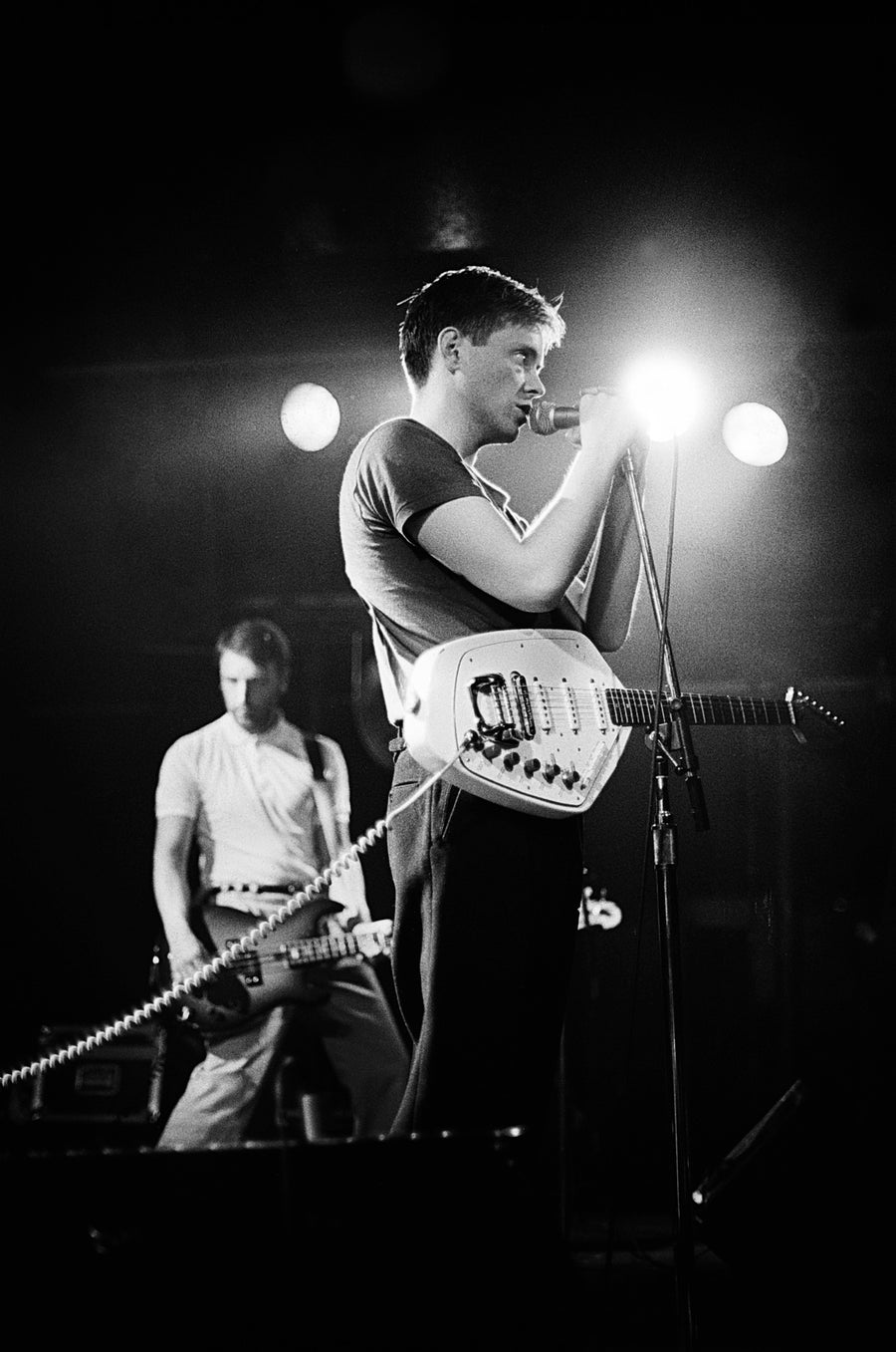 New Order performing, Boston, Massachusetts, 1980, photographed by Michael Grecco.