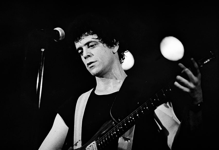 Lou Reed performing with guitar, Boston, Massachusetts, 1981, photographed by Michael Grecco.