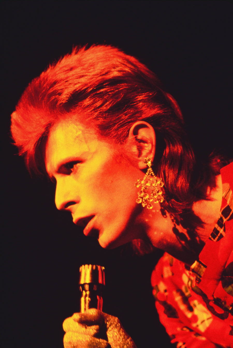 David Bowie at the Microphone, Scotland, 1972, photographed by Mick Rock.