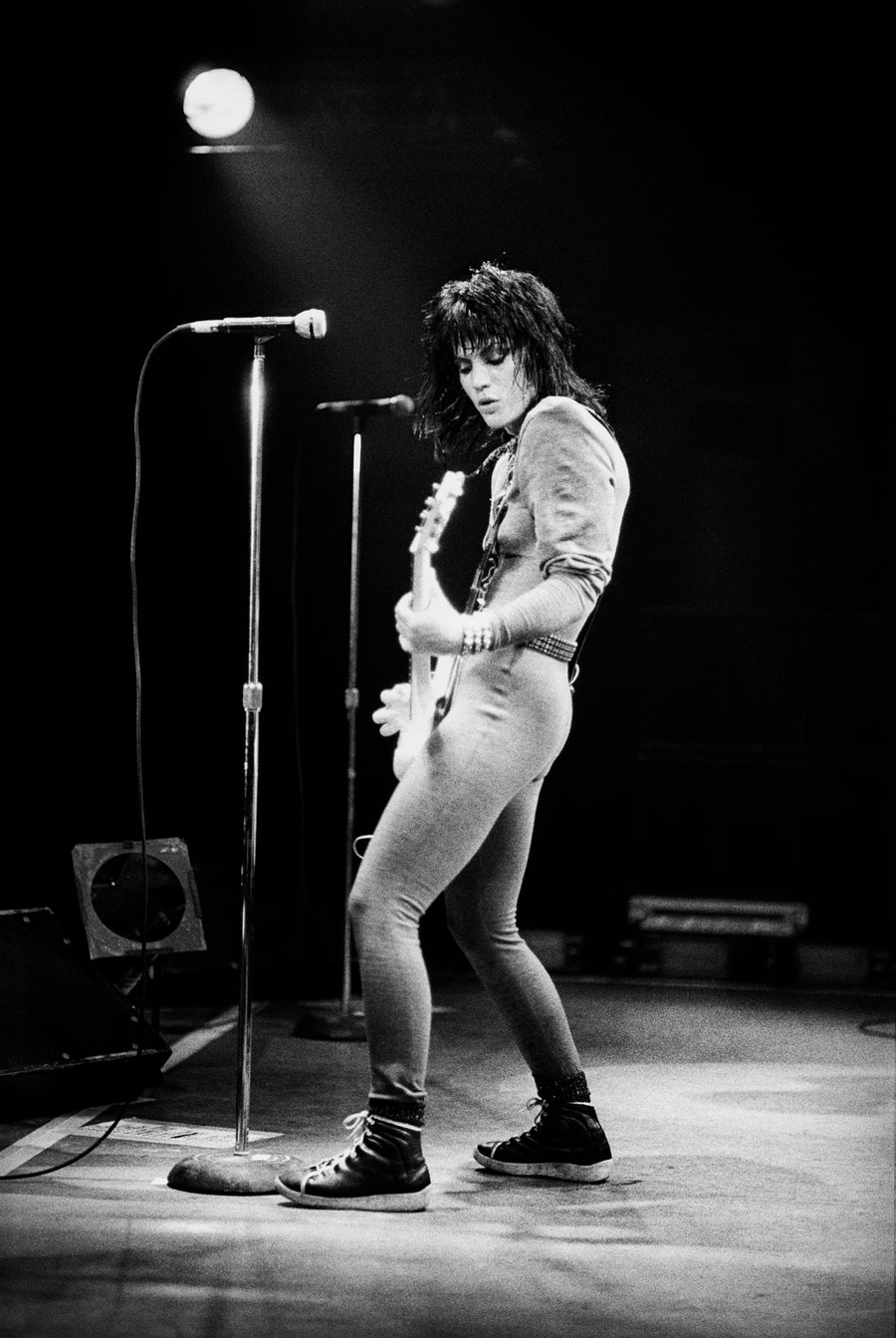 Joan Jett performing with guitar, Boston, Massachusetts, 1981, photographed by Michael Grecco.