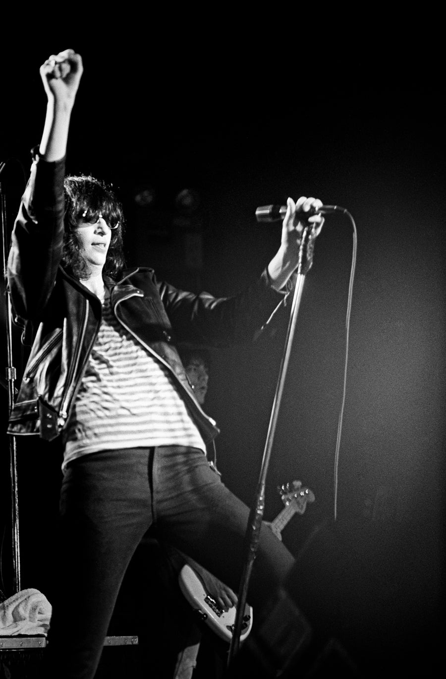 Joey Ramone performing, Boston, Massachusetts, 1981, photographed by Michael Grecco.