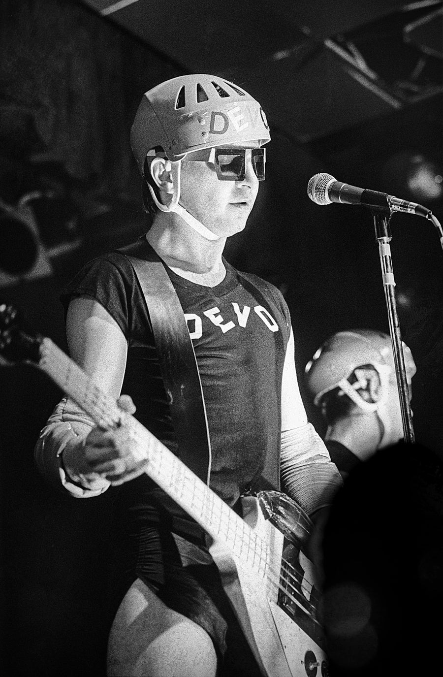 Devo with guitar and microphone, Boston, Massachusetts, 1978, photographed by Michael Grecco.