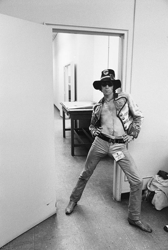 Keith Richards beside a sprinkler valve on the Their Satanic Majesties Request set, New York, photographed by Michael Cooper, 1967.