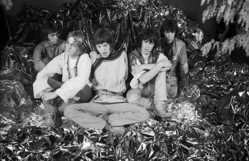 The Rolling Stones seated in the hand-built Their Satanic Majesties Request set, New York, photographed by Michael Cooper, 1967.