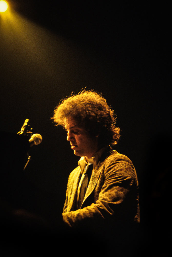 Billy Joel, On Stage, 1980, photographed by Lynn Goldsmith.