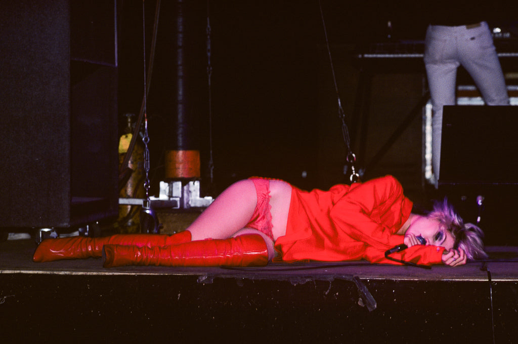 Debbie Harry of Blondie, In Red, 1978, photographed by Lynn Goldsmith.