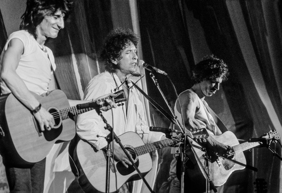 Bob Dylan, Ronnie Wood and Keith Richards, In Concert, 1985, photographed by Lynn Goldsmith.