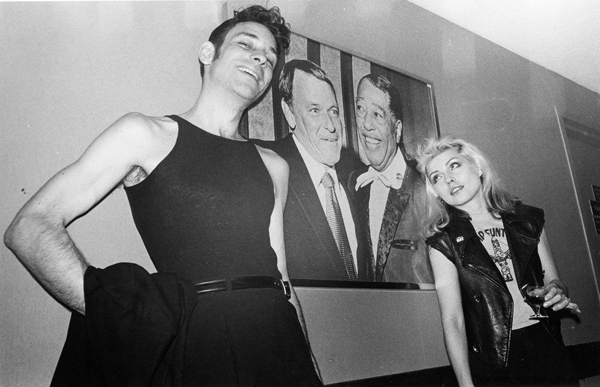 Debbie Harry backstage with an unidentified companion, photographed by Ebet Roberts.