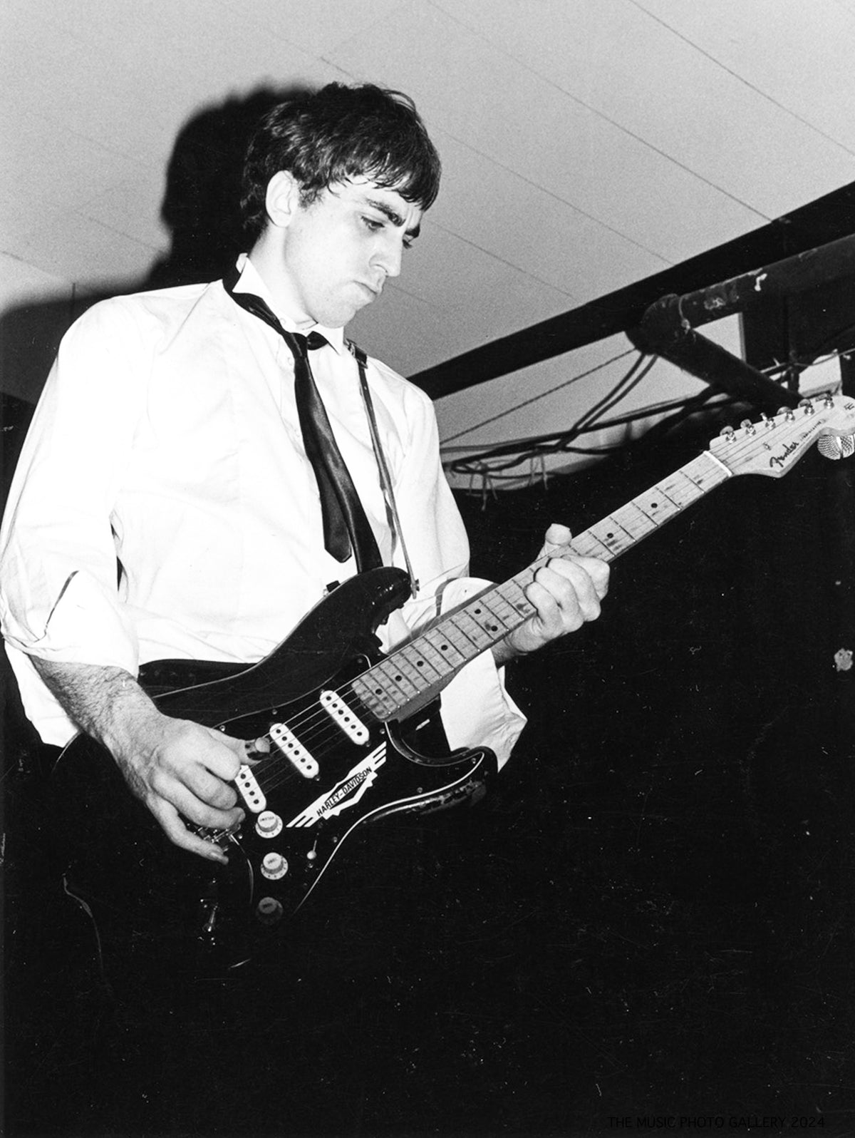 Chris Stein performing with Blondie, photographed by Ebet Roberts.