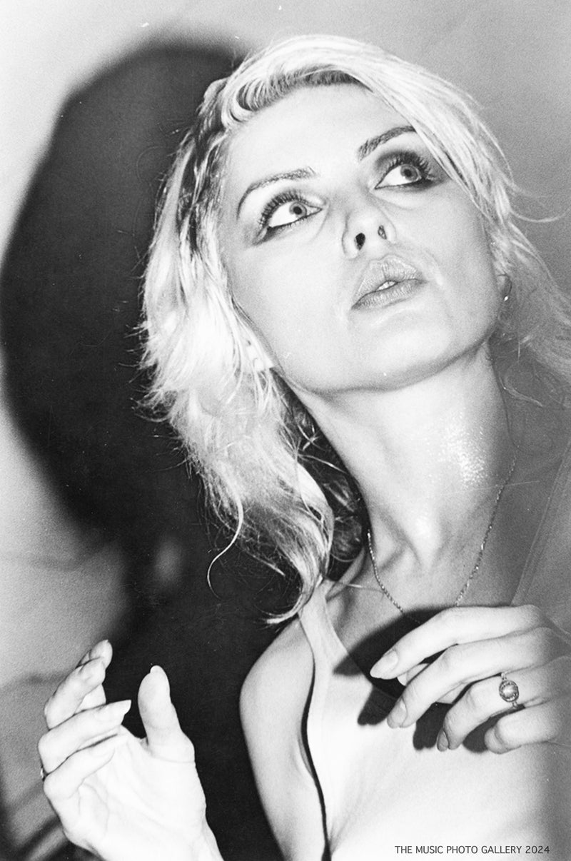 Debbie Harry in a close backstage portrait, photographed by Ebet Roberts.