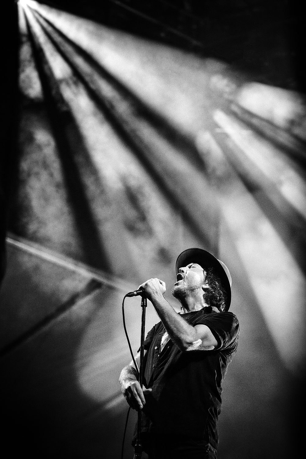 Eddie Vedder under stage lights at Ohana Festival, Dana Point, California, 2026, photographed by Jérôme Brunet.