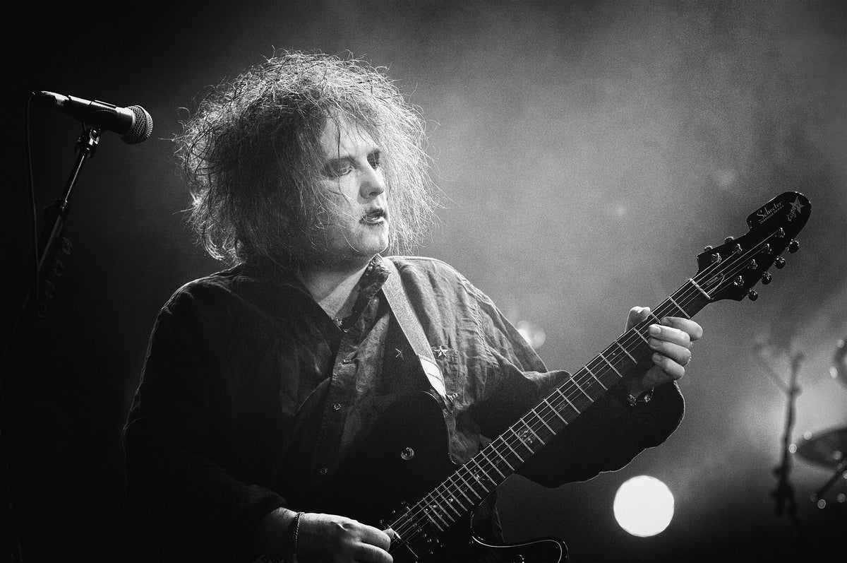 Robert Smith playing guitar at Shoreline Amphitheatre, Mountain View, California, 2007, photographed by Jérôme Brunet.