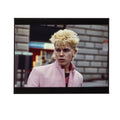 Billy Idol bleached and spiky on a New York street in a pale-pink jacket, photographed by Roberta Bayley, 1978.