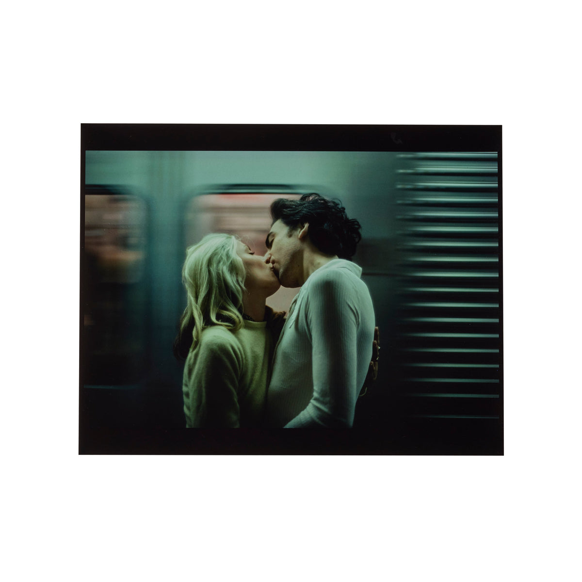 Debbie Harry and Chris Stein kissing on a New York subway train, photographed by Roberta Bayley, 1976.