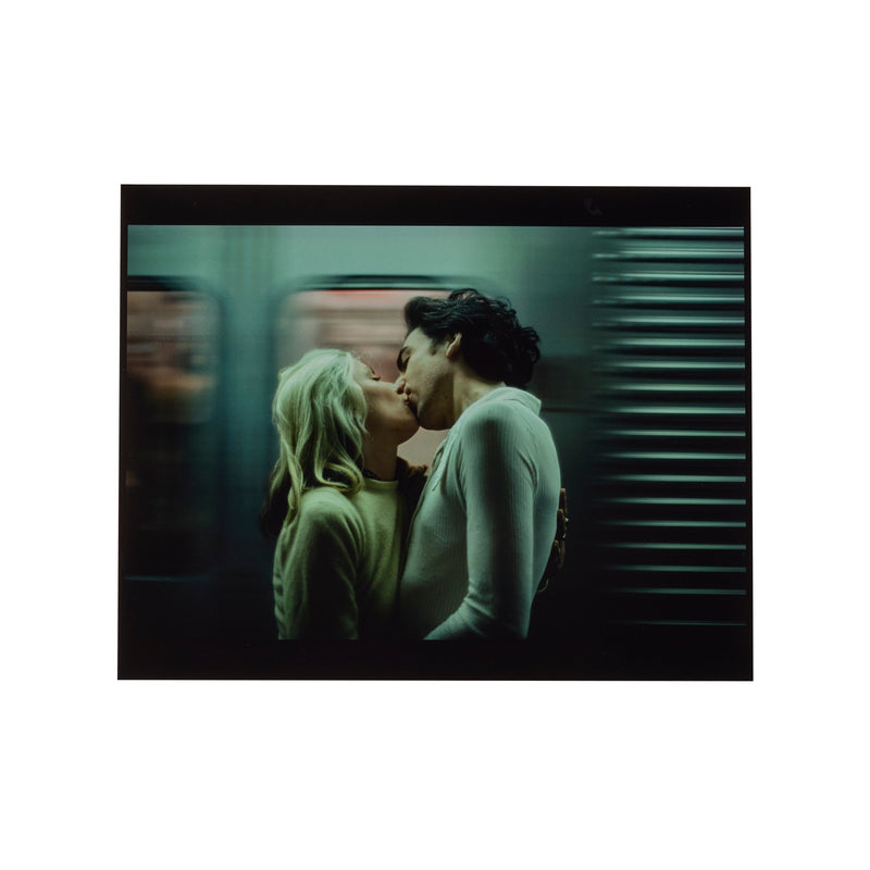Debbie Harry and Chris Stein kissing on a New York subway train, photographed by Roberta Bayley, 1976.