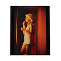 Debbie Harry in profile against Las Vegas neon, lipstick in hand, photographed by Roberta Bayley, 1979.