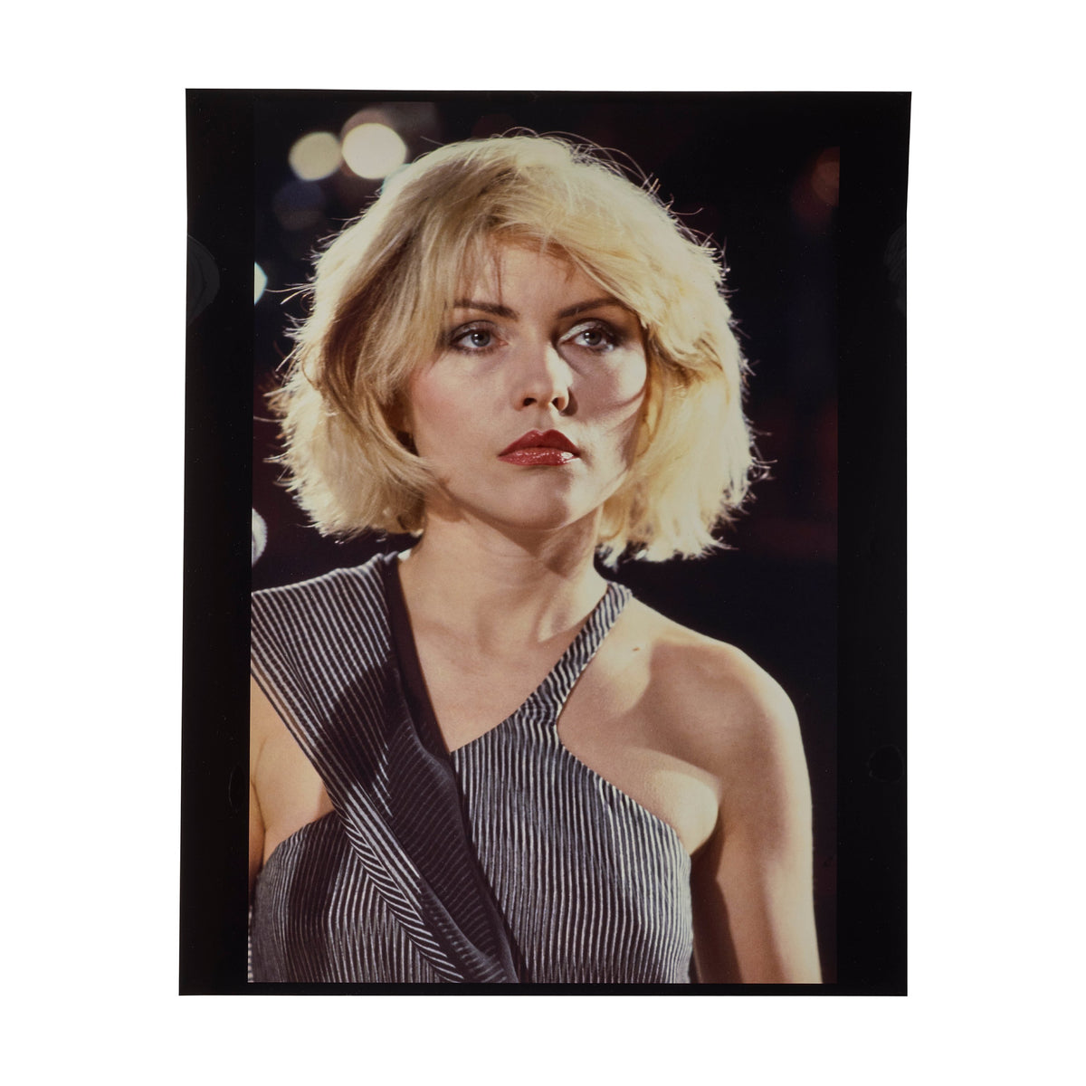Debbie Harry on the set of Blondie's Heart of Glass video, three-quarter portrait with her gaze turned to the side, photographed by Roberta Bayley, 1978.