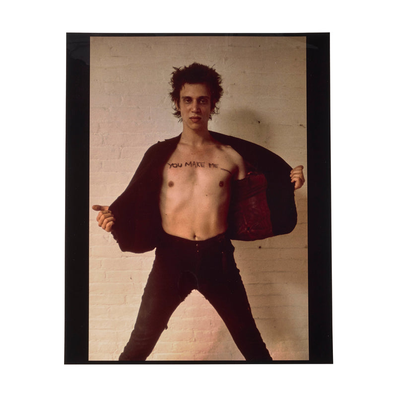 Richard Hell with 'YOU MAKE ME ___' written across his chest, the Blank Generation cover image by Roberta Bayley, 1977.