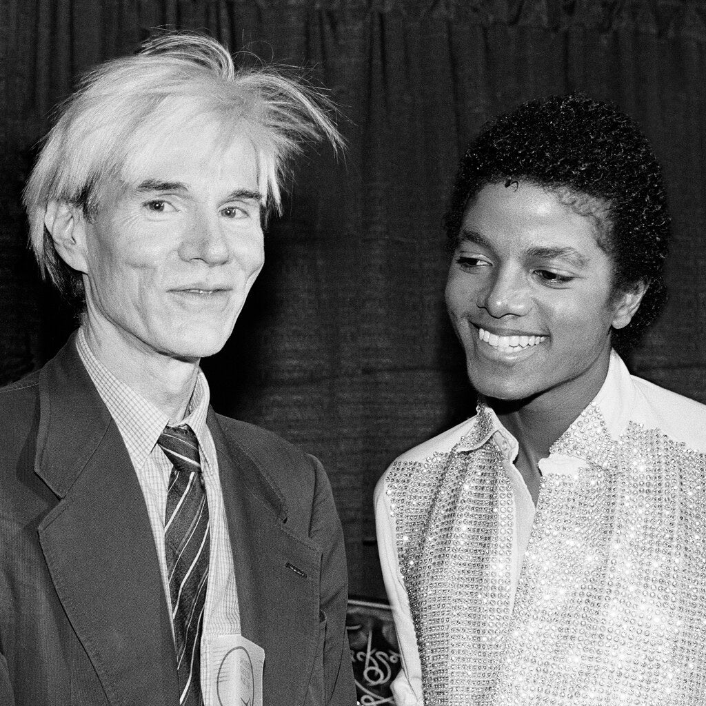 Andy Warhol and Michael Jackson side by side, in black and white, 1981, photographed by Lynn Goldsmith.