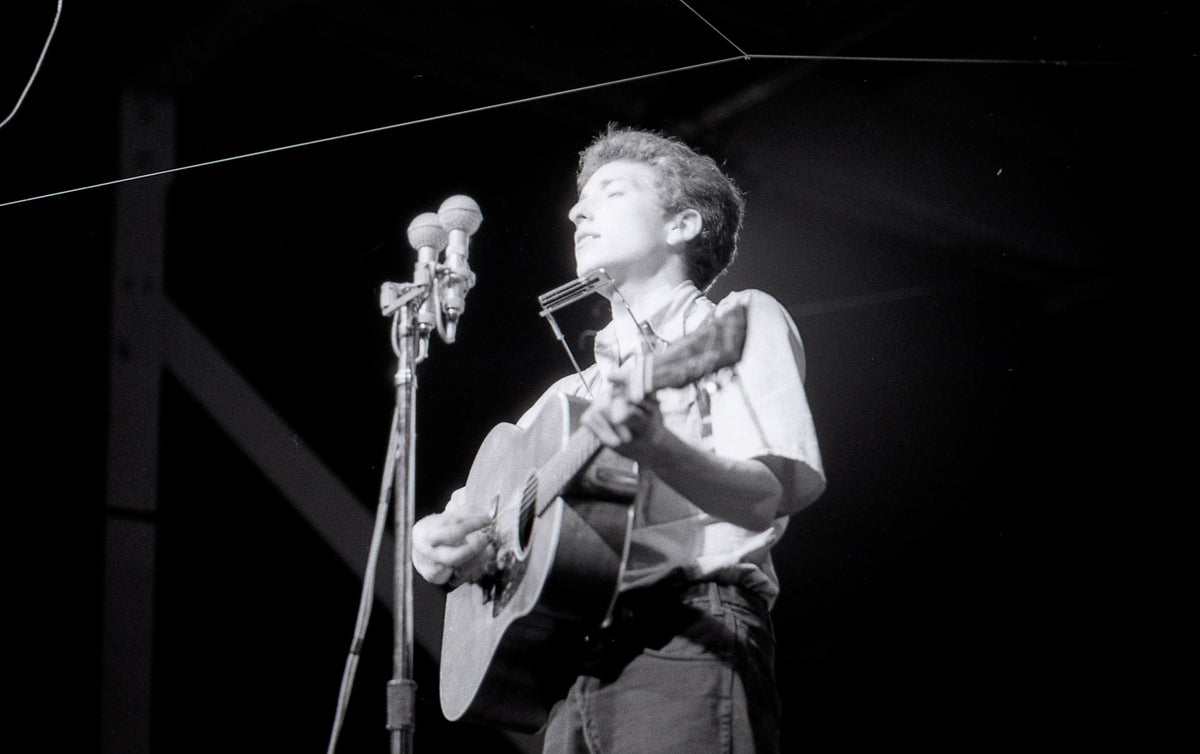 Bob Dylan with Harmonica, Newport Folk Festival, Newport, Rhode Island, July 1963; photograph by John Byrne Cooke.