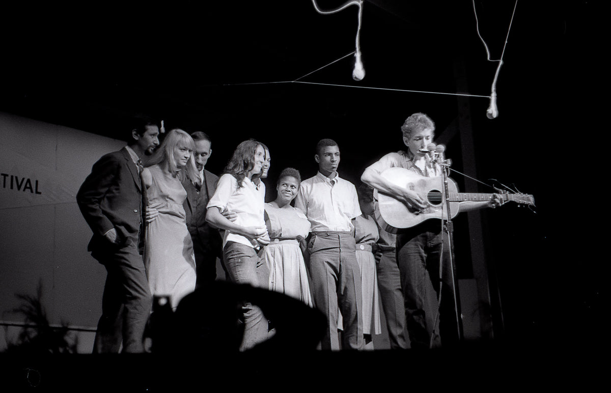 Bob Dylan in the We Shall Overcome Finale, Newport Folk Festival, Newport, Rhode Island, July 1963; photograph by John Byrne Cooke.