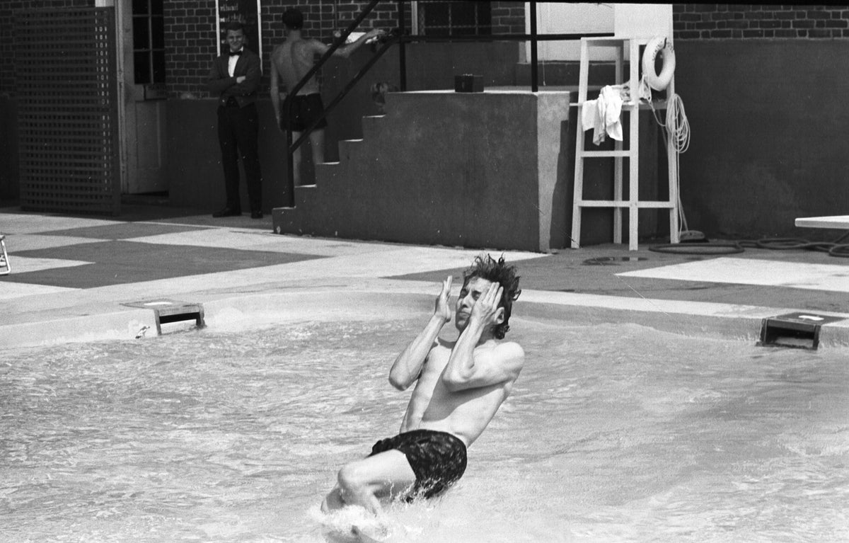 Bob Dylan Jumping into the Pool, Viking Hotel, Newport, Rhode Island, July 1964; photograph by John Byrne Cooke.