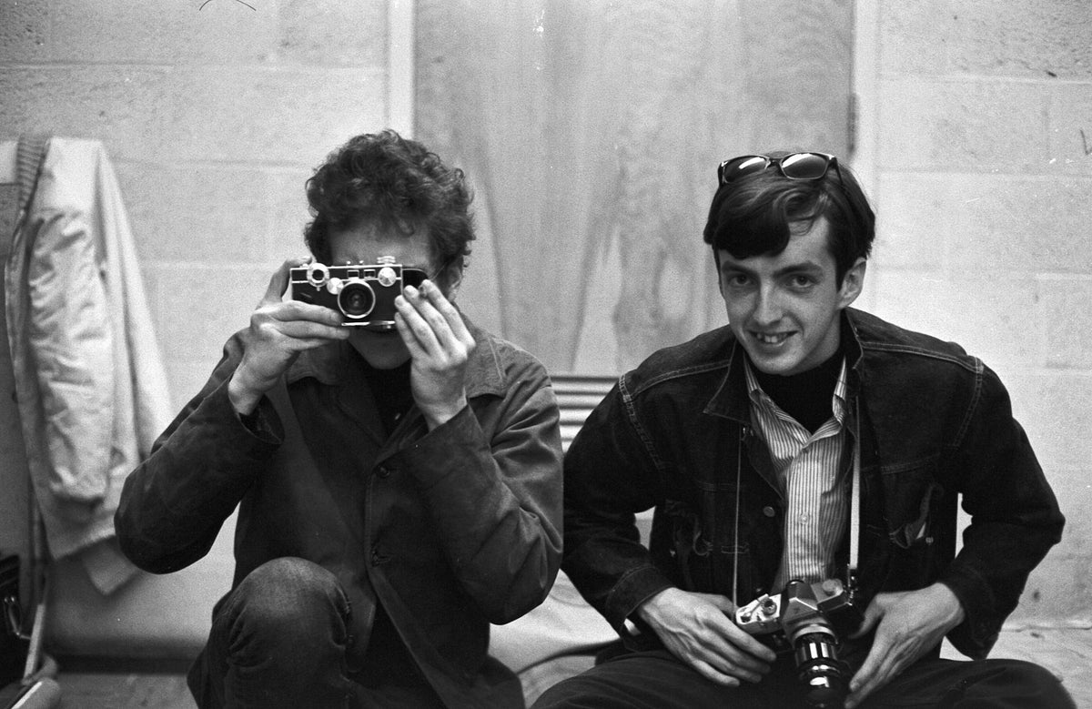 Bob Dylan with a Camera, Brandeis Folk Festival, Waltham, Massachusetts, April 1964; photograph by John Byrne Cooke.